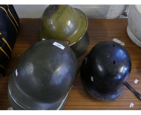 A German Luftshutz helmet, mid 20th CenturyWith brown leather liner, black painted shell, with eagle and swastika decal, two 