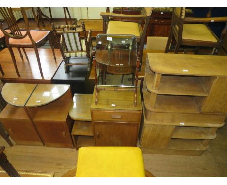 A suite of Art Deco styled light oak furniture comprising two small single door and two shelf cabinets together with a furthe