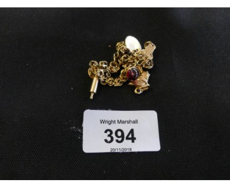 An 18ct gold charm bracelet, the fancy link chain suspending fine charms to include a rolling pin and a Taurus charm, with on