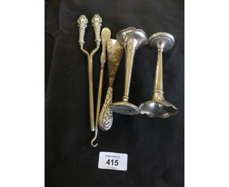 A mixed lot of various silver wares comprising pair of posy vases with loaded bases, glove stretchers, shoe horn and button h