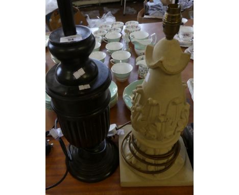 A reconstituted stone table lamp, of architectural form, together with a further oak table lamp (2) (sold electrically untest