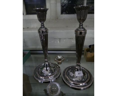 A pair of good quality silver-plate on copper candlesticks of fluted form, raised on spreading circular bases 