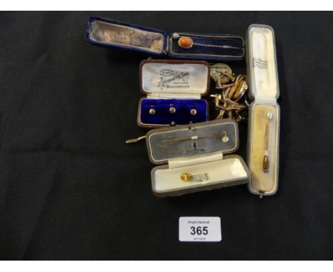 A selection of items To include cased stick pins, cased shirt studs, and three wristwatches. 