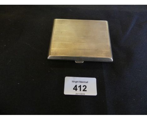 A silver cigarette case of hinged rectangular form, decorated with engine turned detail, London hallmarked, approx 3.2oz 
