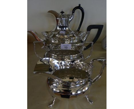 A silver-plated four piece tea set, raised on swept legs with paw feet 