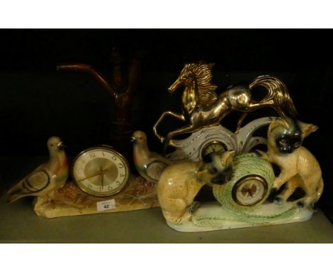 Three various retro mantel clocks in novelty animal decorated ceramic cases, together with a wooden table lamp (4) 