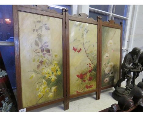 A floral decorated oak framed firescreen 