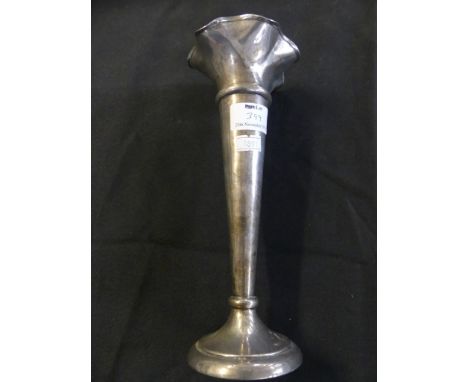 A large silver stem vase, with frilled rim and circular loaded base, bearing Sheffield hallmarks 