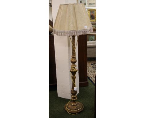 A heavily carved gilt pine standard lamp with a velum shade (not tested)