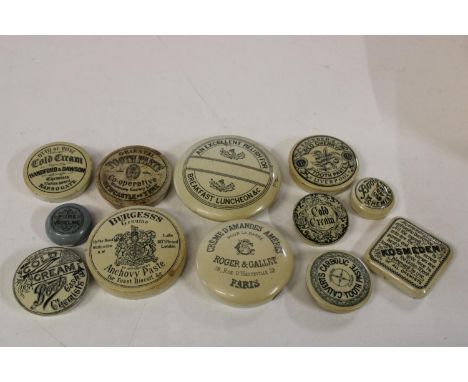 A job lot of antique ceramic pot lids 