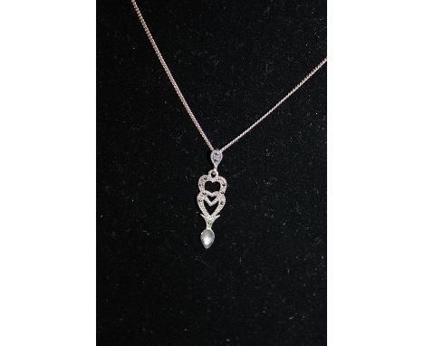 A silver &amp; marcasite pendant on a silver chain 