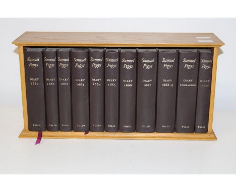 A Folio Society 2003 set of Samuel Pepys diary's in display shelf 