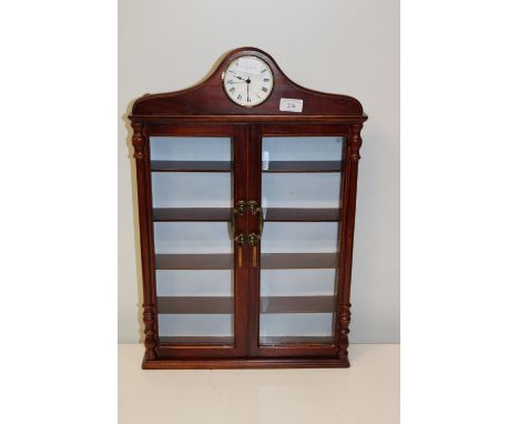 A useful wall hanging display cabinet with clock h61cm 