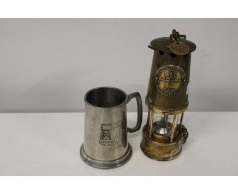 A vintage miners lamp with pay check &amp; vintage miners tankard 