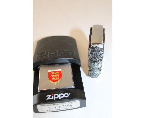 A boxed Zippo Lighter and a Harley Davidson lighter 