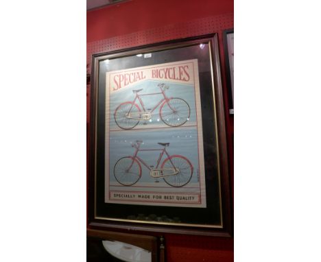 A glazed and framed bicycle print 