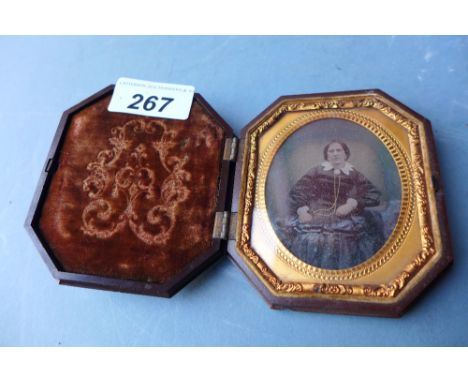 A Victorian Daguerreotype portrait of a lady in a gilt mount in original case 