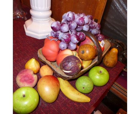 A collection of painted ceramic fruit and others