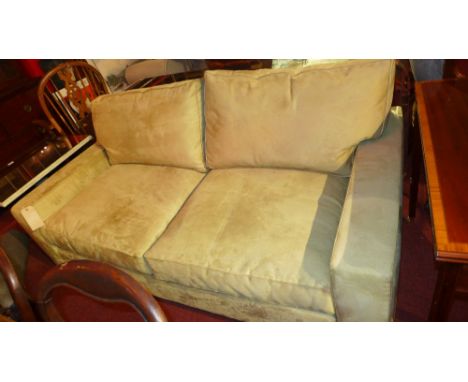 A contemporary designer two seater sofa upholstered in suedette fabric 