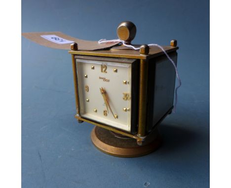 An Imhof Swiss clock, hygrometer, barometer and thermometer of cube form, on a swivel base 