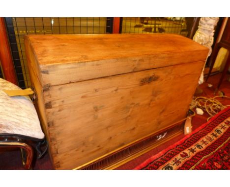 An antique pine and metal bound dome top trunk with twin handles 