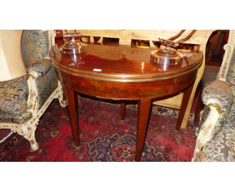 A French mahogany demi lume and gilt metal bound card table the foldover top raised on square tapering supports