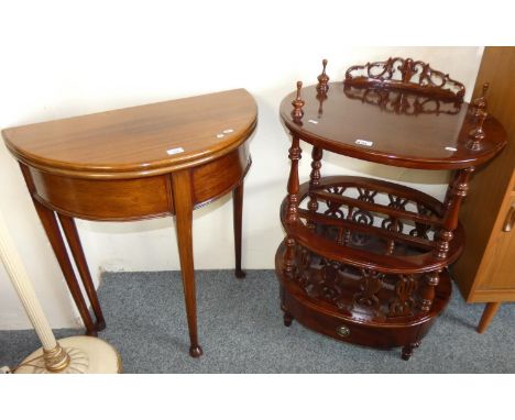 A fold over demilune mahogany table, 80cm tall, 70cm wide, together with a modern mahogany combination table/magazine rack (2