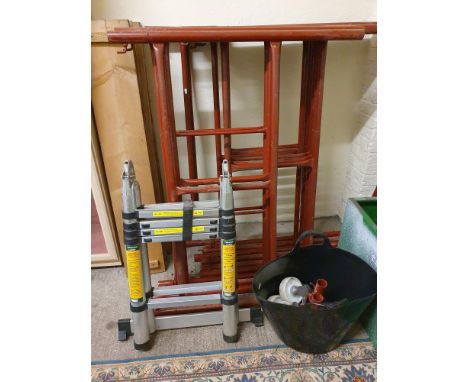 A sectional metal scaffold tower, with boards and wheels, together with a Coopers telescopic ladder (2). 