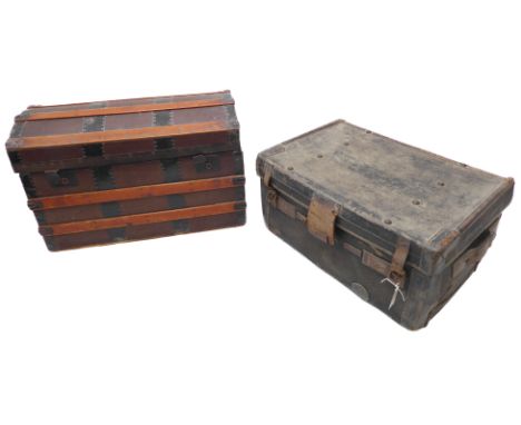 An early 20th century wooden dome-topped trunk with metal mountings and wooden slats (76cm x 45cm wide x 49cm high) and a can