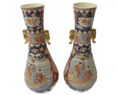 A pair of large floor-standing&nbsp;baluster-shaped&nbsp;Japanese ceramic vases; each with flaring neck above two gilded flan