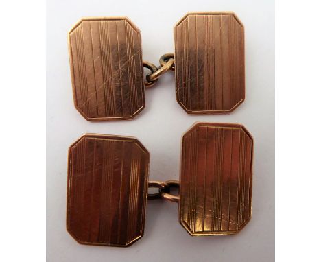 A pair of gentleman's 9-carat rose gold cuff links with engine turned decoration (approx. 6.8g), together with a cased set of