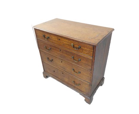 A late 18th century oak chest; the moulded top above four full-width graduated drawers, brass swan necked handles raised on b