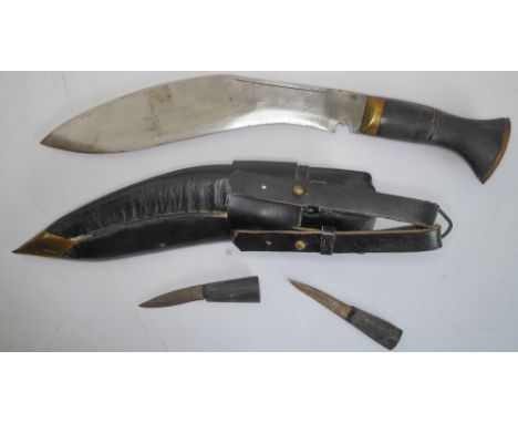 A modern kukri with brass chapri and kanjo - the scabbard with faras and brass khothi. Purchased in 2002 from a guard of the 