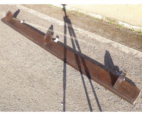 A heavy and wide wall-mounting oak shelf (230cm wide x 15cm deep)