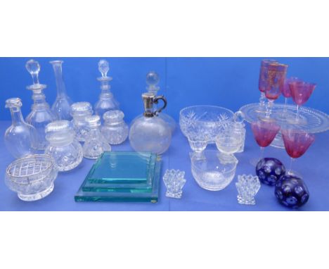 A good and varied selection of glassware to include 19th century decanters, cranberry glass champagnes, bowls, storage jars, 