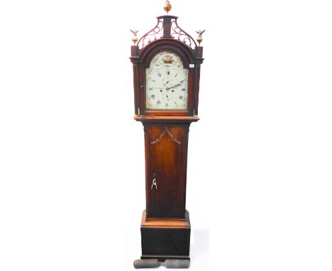 A large early 19th century oak-cased eight-day longcase clock: the pierced pediment with foliate scrolls and three gilt finia