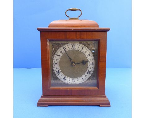 A walnut cased&nbsp; mantle clock by 'Smith's English Clock's Ltd'; silvered dial with Roman Numerals and with electrical mov