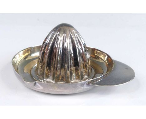 A white metal lemon squeezer, in the form of a sombrero, with half round proud handle, max length 10.5cm