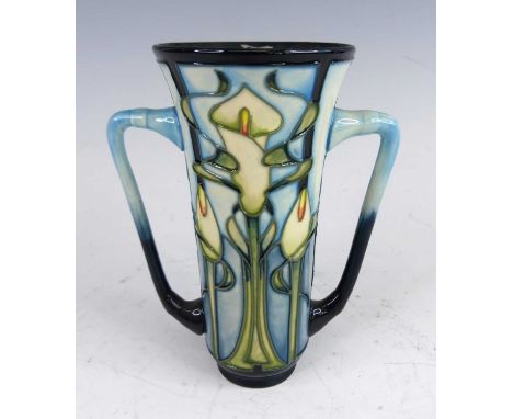 A contemporary Moorcroft Calla Lily pattern pottery twin handled loving cup, designed by Emma Bossons, impressed and printed 