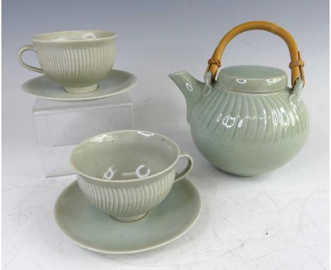David Leach (British, 1911-2005), a celadon glazed studio pottery teapot and cover, with bent cane handle, studio stamp verso