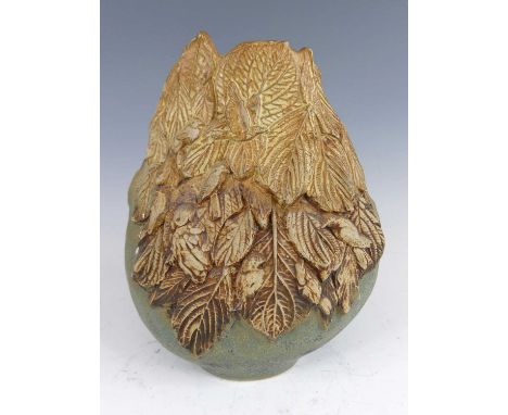 Bernard Rooke (British, b.1938) - a large studio pottery vase, partially glazed, with raised stylised floral bird and owl dec