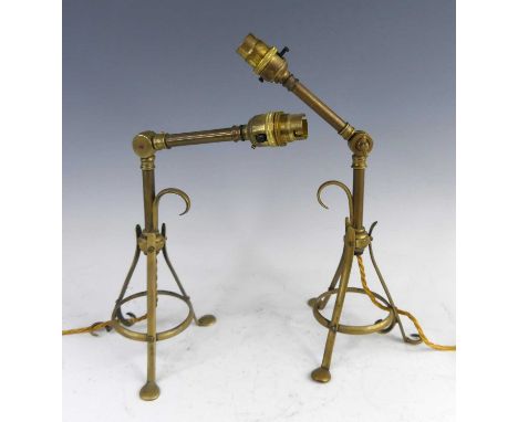 A pair of circa 1900 gilt brass Pullman adjustable table lamps, in the style of W.A.S. Benson, each with movable branch arms 