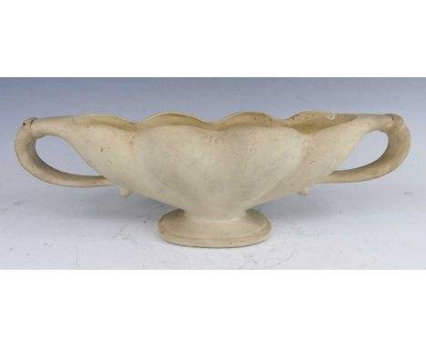 An early 20th century Fulham Pottery twin handled mantel vase, of lobed and elongated form, on footed base, unglazed earthenw