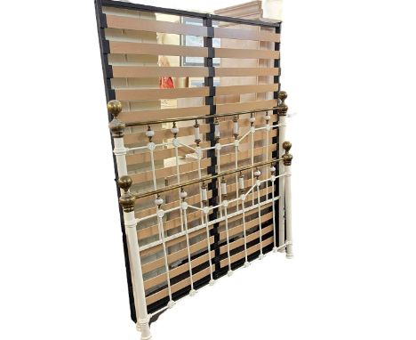 Victorian style white and brass double bedstead.