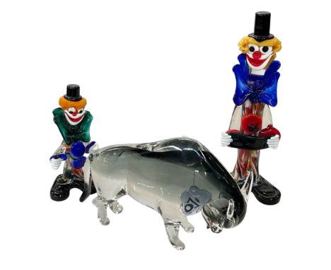 Two Murano clowns and a Baccarat glass bull.