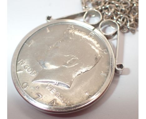 1974 silver half dollar in silver mount suspended on a silver chain 
