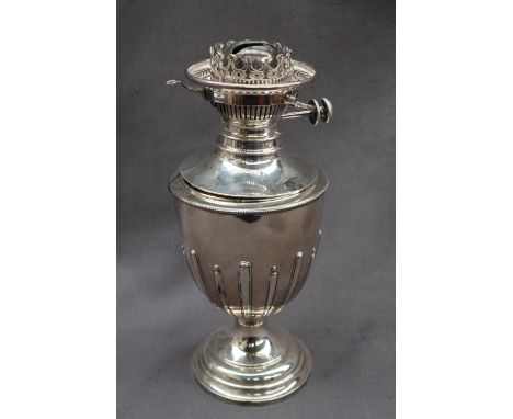 A Victorian silver oil lamp, of vase shape with a beaded rim and spreading foot, Sheffield, 1893, James Deakin & Sons, 33cm h