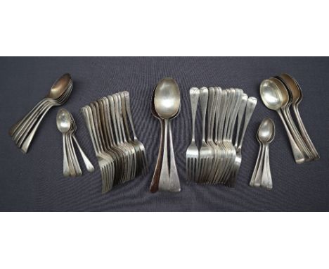 A George V silver part flatware service comprising a set of twelve table spoons, twelve dessert forks, eleven dessert spoons,