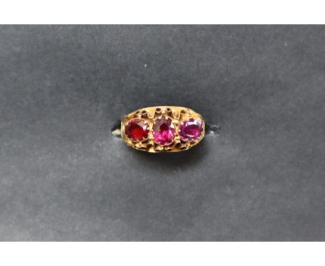 A 22ct gold ring set with three oval faceted amethysts set, size K 1/2 approximately 1.5 grams