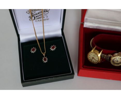 A 9ct gold ruby and diamond pendant on a 9ct gold chain, together with a pair of matching earrings, approximately 4 grams, a 